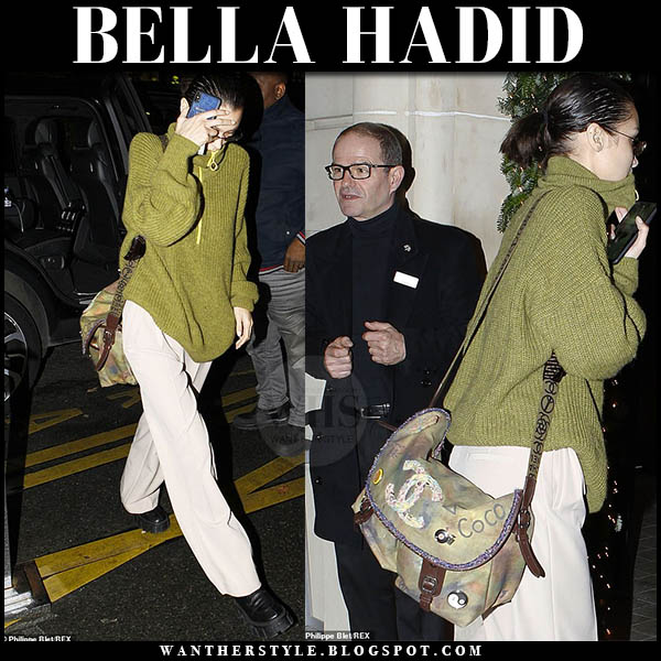 Bella Hadid in green sweater, white pants and green messenger bag in