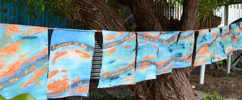 Fish swimming prayer flags