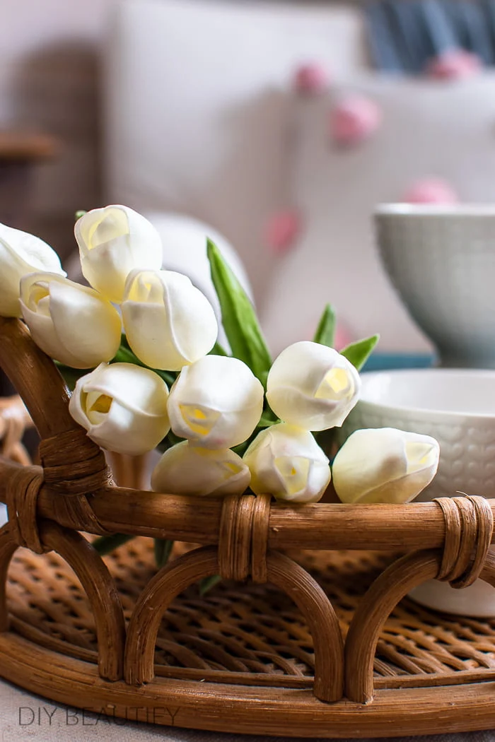 white faux tulips in wicker tray