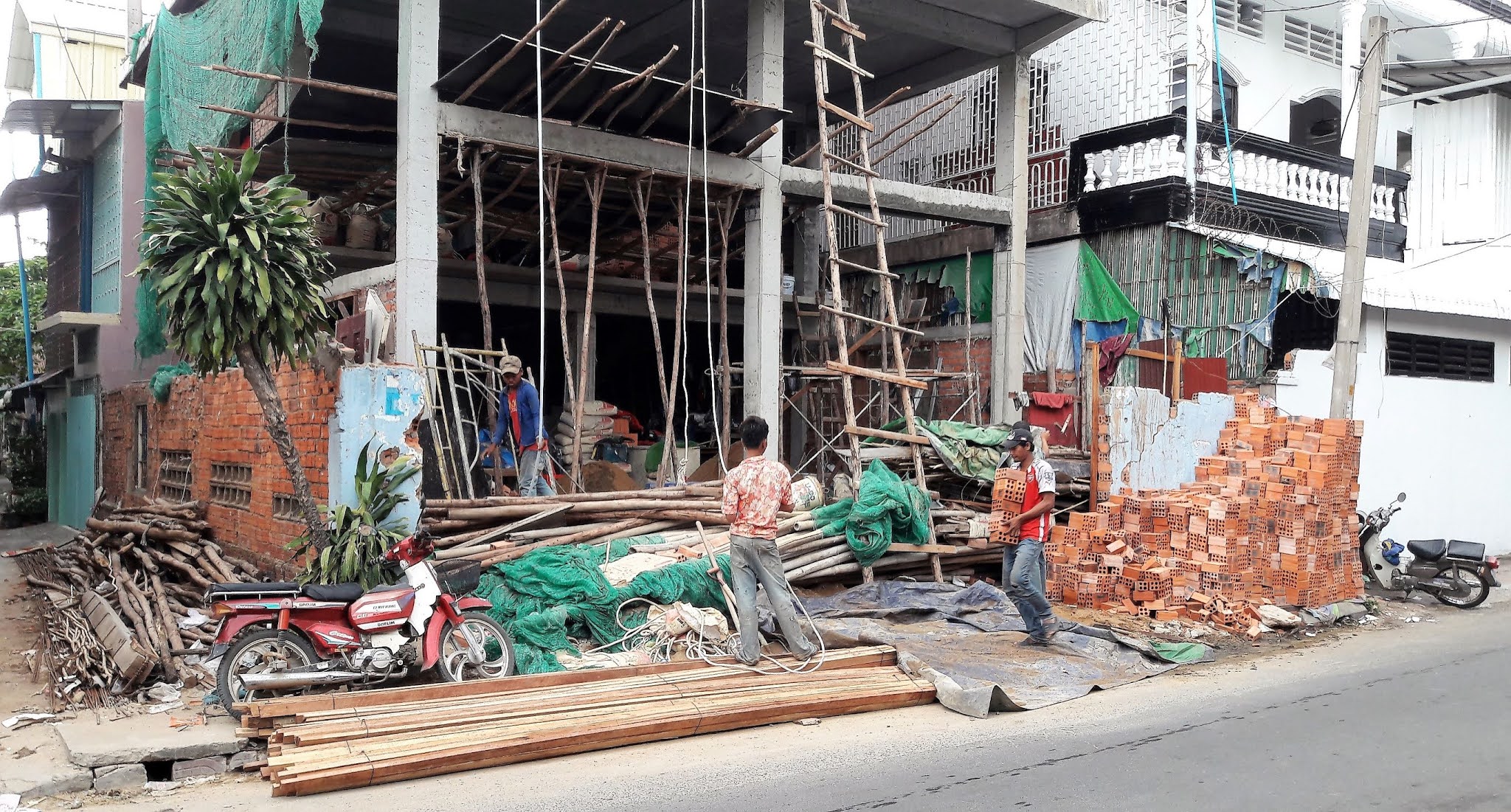 workers building a house in Phnom Penh