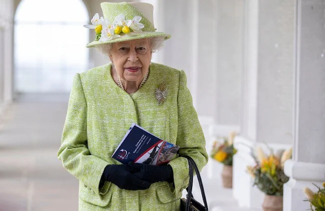 Queen Elizabeth, wearing a lime green coat and the Wattle brooch presented to her on first tour of Australia in 1954