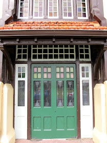 Doorway of a large elizabethan-style building.