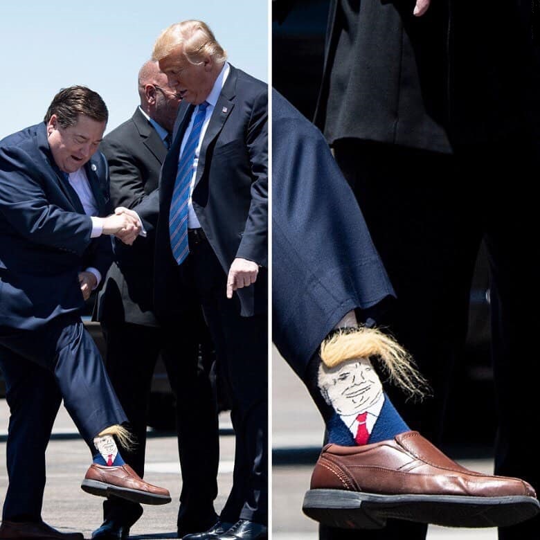 Louisiana governor greets the president wearing a pair of novelty Trump sock - Bookairo