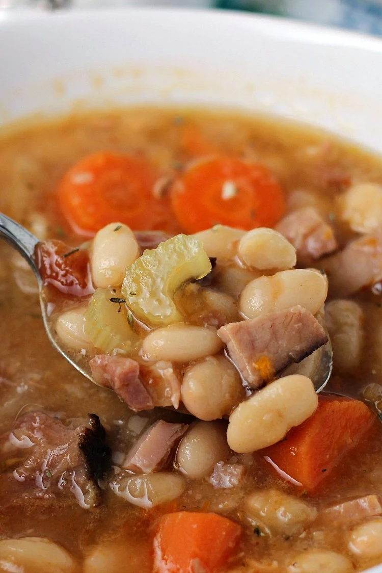 Ham and Bean soup on spoon in bowl