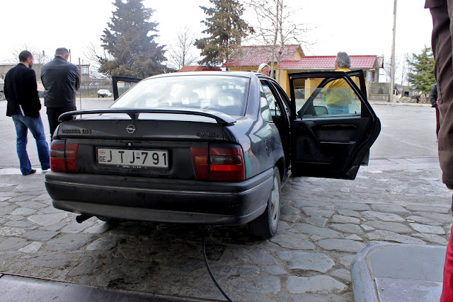 When our taxi had to fill up with fuel, the driver asked us all to get out. We looked around the petrol station and all the passengers exited the cars to fill up. Georgia