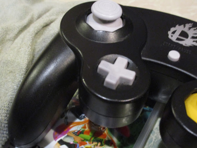 Dirty grimy sweat black Smash Bros Nintendo GameCube controller wash cloth