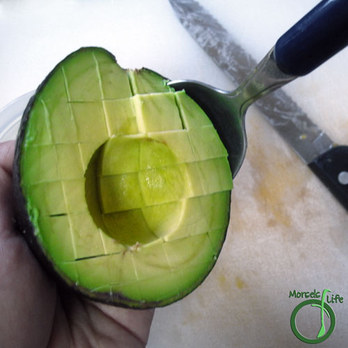 Morsels of Life - How to Cut an Avocado Step 4 - Cut cross hatch pattern into each avocado half, making sure not to slice through the skin. Scoop out flesh.