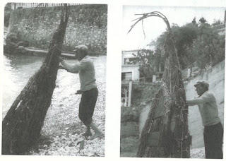 Fisherman standing a papyrella on end to dry