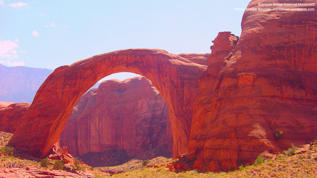 red natural arch glowing in the daylight