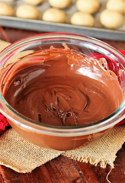Small Glass Bowl of Melted Chocolate Image
