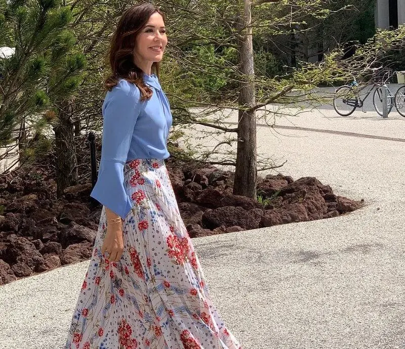 Crown Princess Mary wore a flare sleeve knot blouse from Victoria Beckham, and sunray pleated scarf print skirt from Paul and Joe