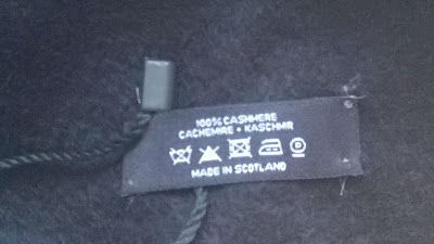 close up of cashmere scarf label made in scotland