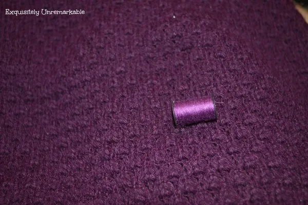 Purple sweater and purple thread to match