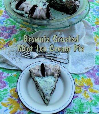 Brownie Crusted Mint Ice Cream Pie, mint chocolate mix-ins are folded into ice cream and frozen in a brownie crust. An assembly only summer treat. | recipe developed by www.BakingInATornado.com | #recipe #icecream