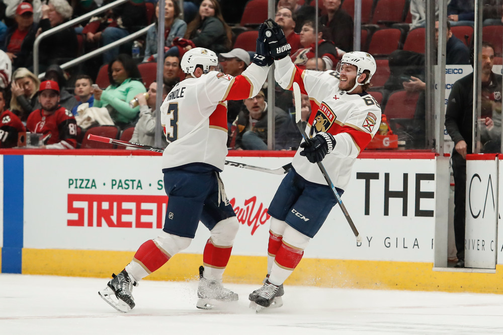 Keith Yandle Florida Panthers Unsigned Red Jersey Goal Celebration vs. Chicago Blackhawks Photograph
