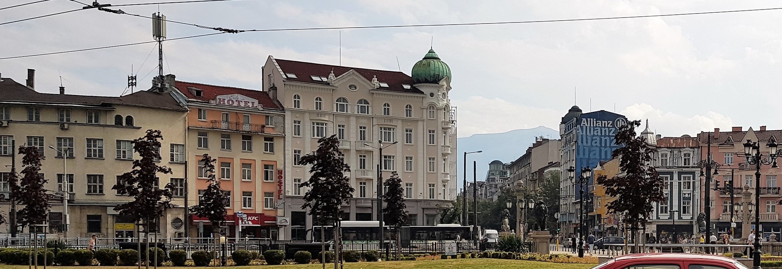 A general view of the Square with cars, people and buildings