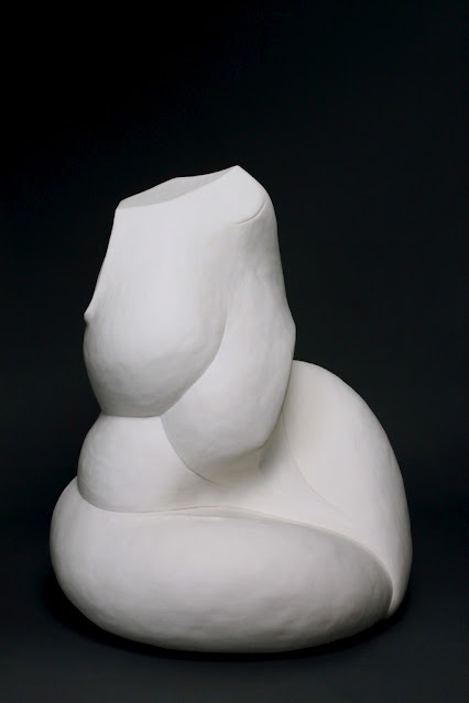 Abstract, curvy female porcelain sculpture.