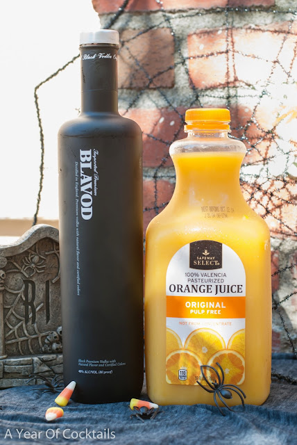 black vodka, orange juice, layered shot, halloween cocktail