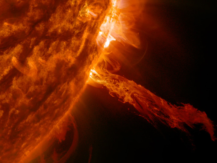 A stream of plasma rises from the sun’s surface