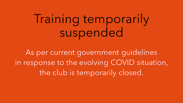 Image with text saying that training is temporarily suspended