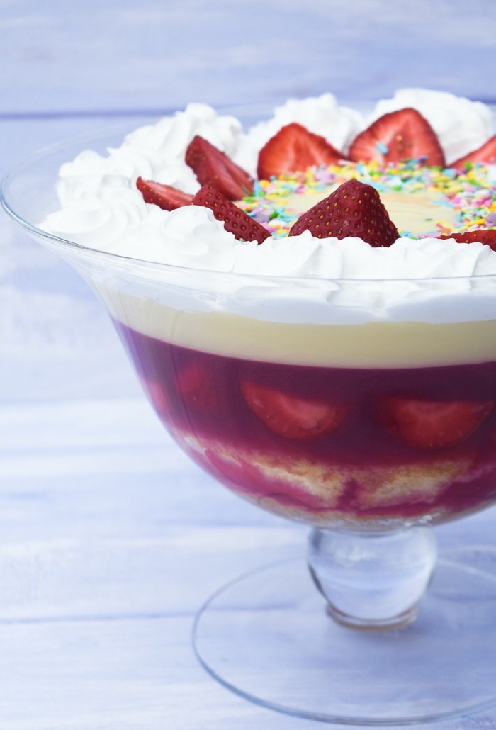 Traditional Scottish Strawberry Trifle in glass bowl showing layers of sponge, jelly, fruit, custard and cream