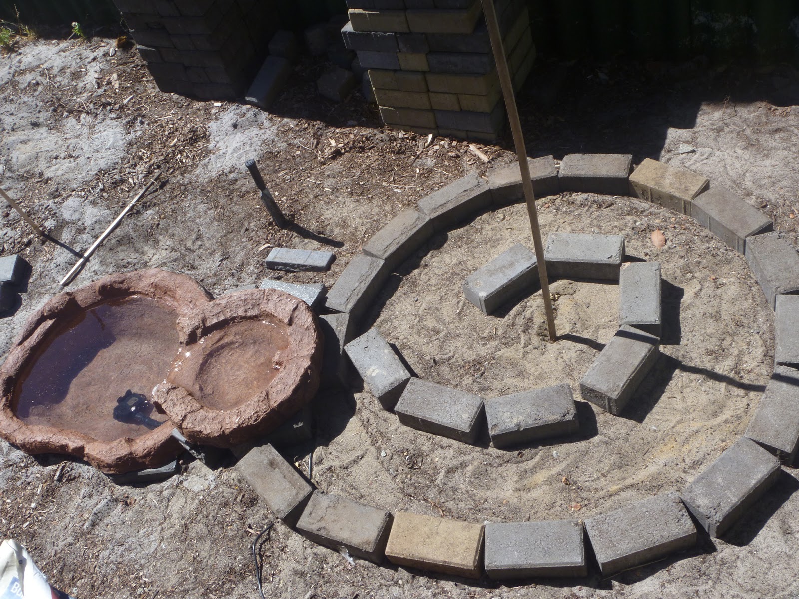 The Little Eden Hill Urban Farm Herb Spiral & Pond