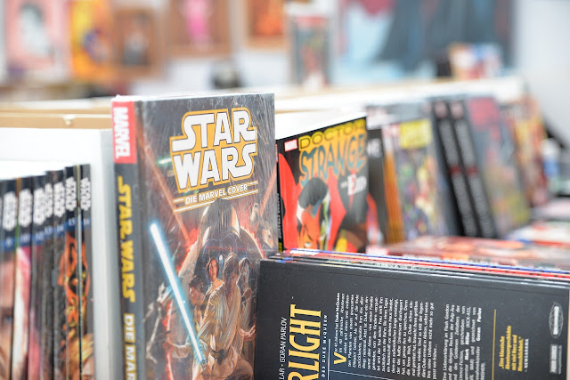 Close up of lots of comic books and graphic novels