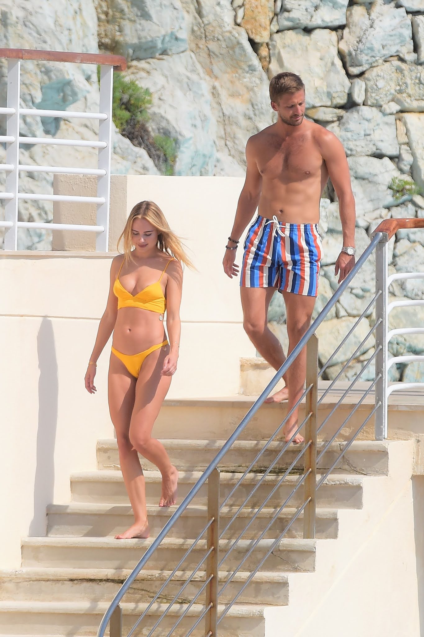 Kimberley Garner shows off her jaw-dropping figure in a TINY yellow bikini during Cannes trip