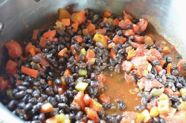 Chipotle Black Beans Recipe ready to be cooked in a soup pot from Serena Bakes Simply From Scratch.
