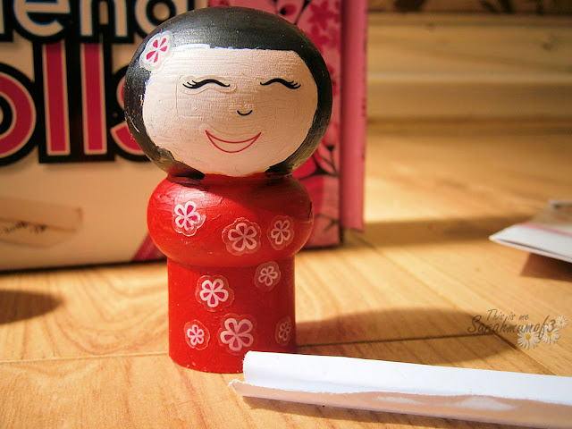 wooden japanese doll painted