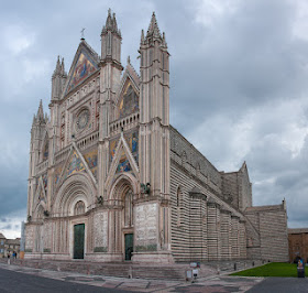 The Cathedral of Santa Maria Assunta in Orvieto, with its handsome facade of marble, gold and mosaics
