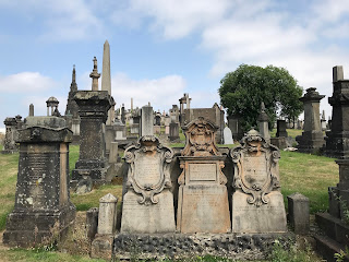 A photo showing various gravestones, monuments and memorials in Glasgow Necropolis.  Photo by Kevin Nosferatu for The Skulferatu Project.