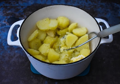 Making Mash Topped Chilli Pie - Step 2 - mashing potatoes