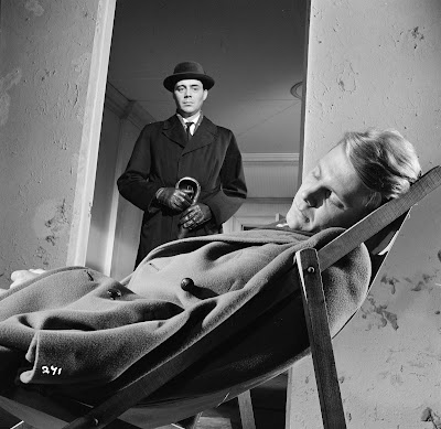 The Servant Dirk Bogarde watches over a sleeping James Fox