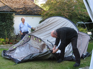 Mr A and J lifting the tent into shape