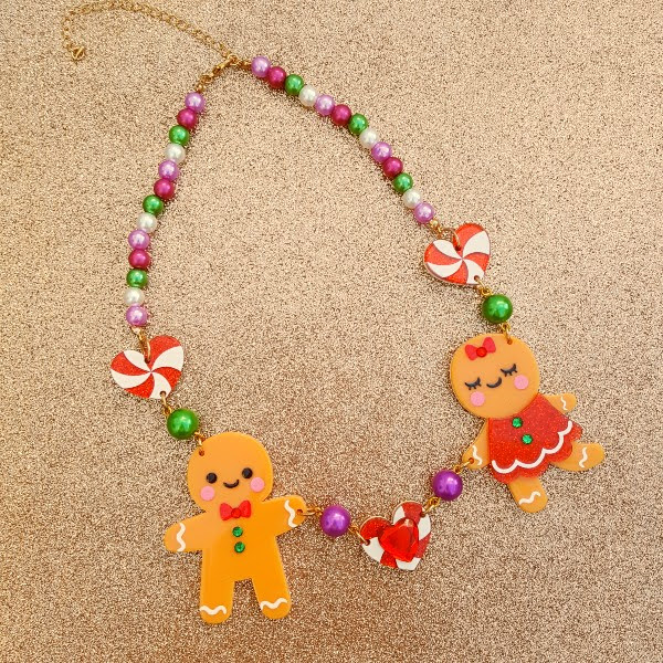 gingerbread boy and girl acrylic necklace on glitter background