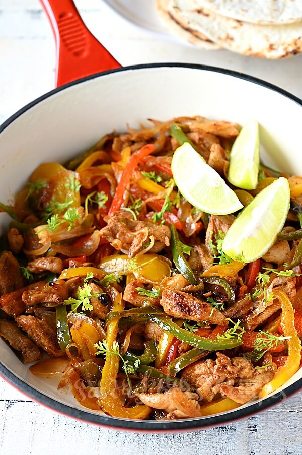 a red skillet with mexican chicken fajitas