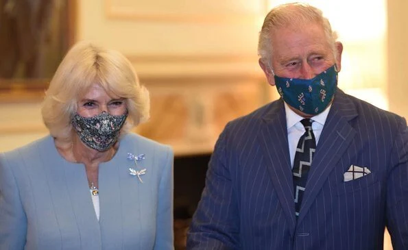 Prince Charles of Wales and Duchess of Cornwall visited the Headquarters of the Bank of England in London. Camilla wore a light blue suit