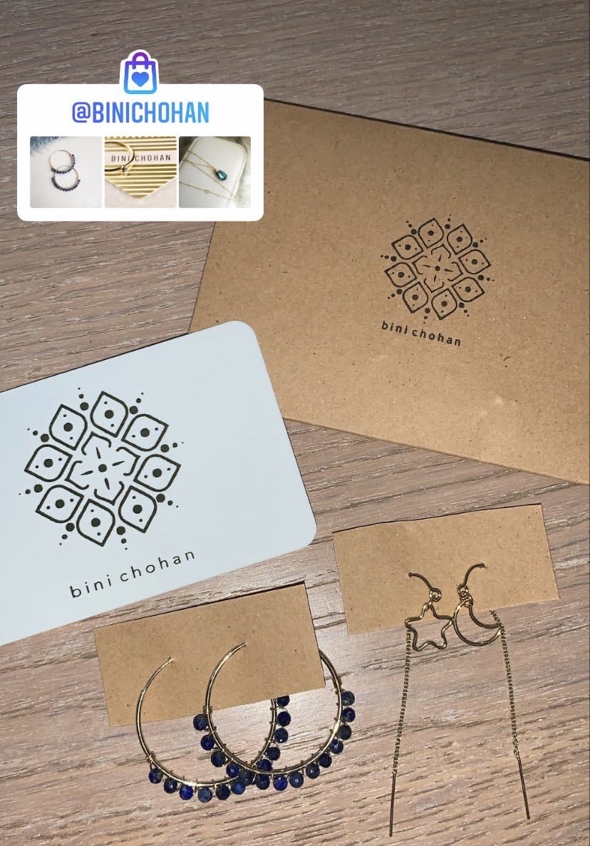 Binichohan packaging and earrings Binichohan order packaging and earrings on a brown surface