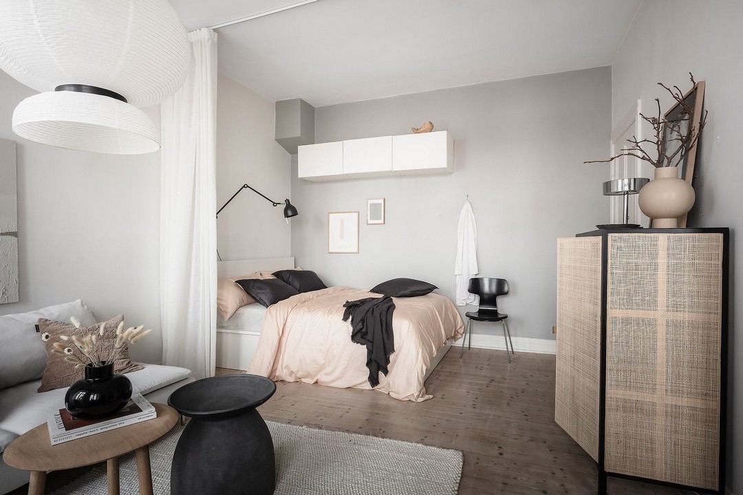 Monochrome home with a glass bedroom wall