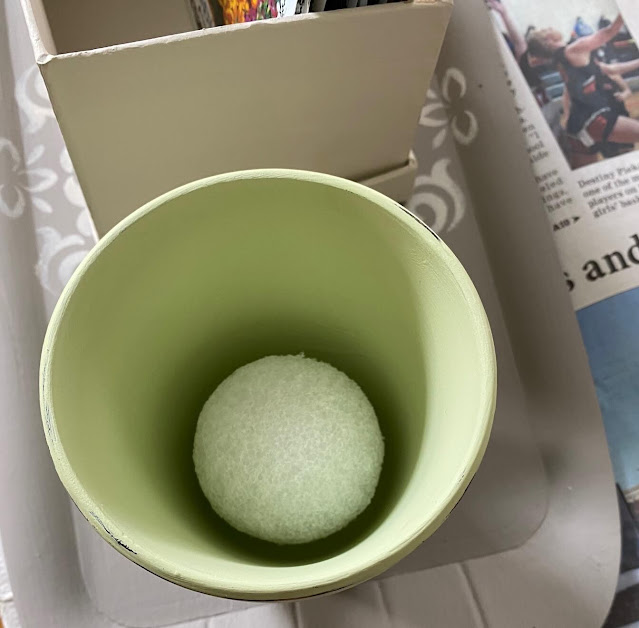 Photo of one styrofoam ball in a pot.