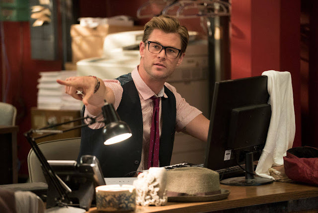 Chris Hemsworth as the dumb blonde beef-cake Kevin Beckman. hemsworth kevin ghostbusters 2016 movie still