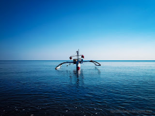 Peaceful Tropical Fishing Beach With Traditional Fishing Boat In The Morning At Banjar Village North Bali Indonesia