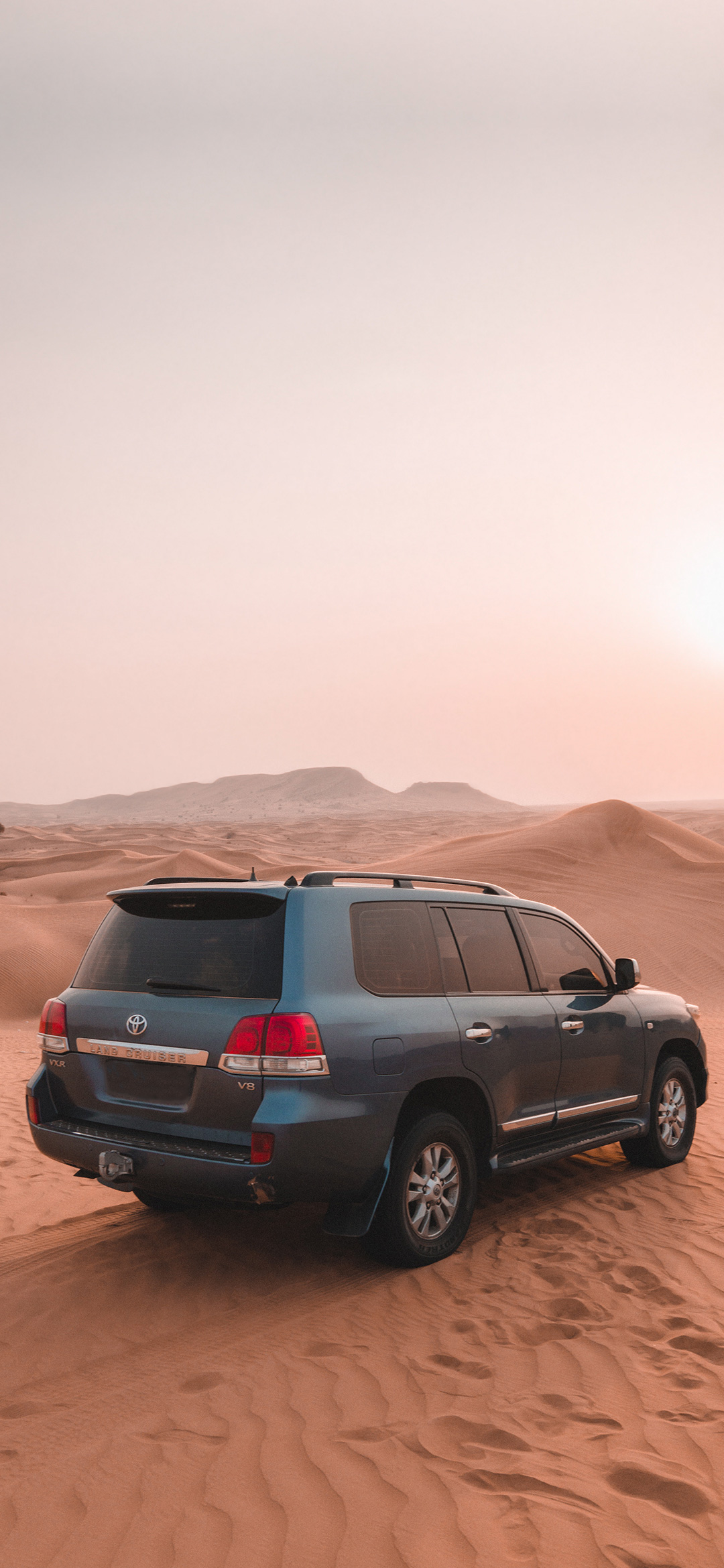 toyota-suv-on-brown-sand-wallpaper