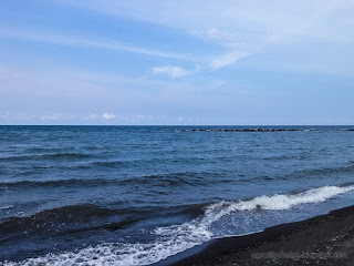 Small Seawater Waves And Coral Reefs In The Distance Of Coastline At Umeanyar Beach, North Bali, Indonesia