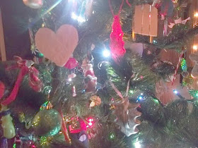 Handmade Paper Heart Ornament, Metal Cookie Cutters,  and Handmade Wooden Decorations.