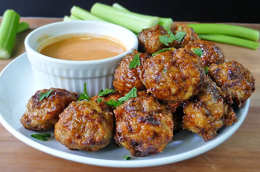 Spicy Chicken Meatballs with a honey glaze and Buffalo Ranch Dipping Sauce | by Life Tastes Good makes a great appetizer, but you might find yourself eating all of them! #ChickenMeatballs #Appetizer
