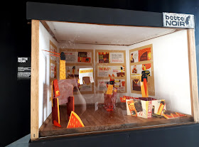 Closeup of an exhibition in a miniature gallery.