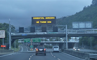 https://commons.wikimedia.org/wiki/File:Covid-19_%27Alert_Level_4%27_highway_sign_%27Essential_Workers_We_Thank_You%27,_Wellington.jpg