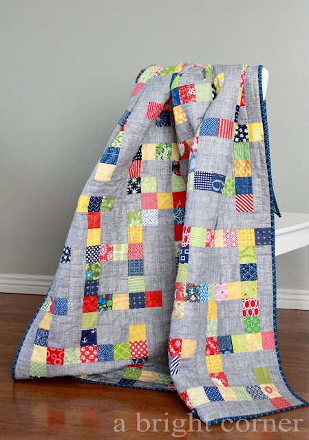 This is a fun, scrappy quilt made with the Mazed quilt pattern